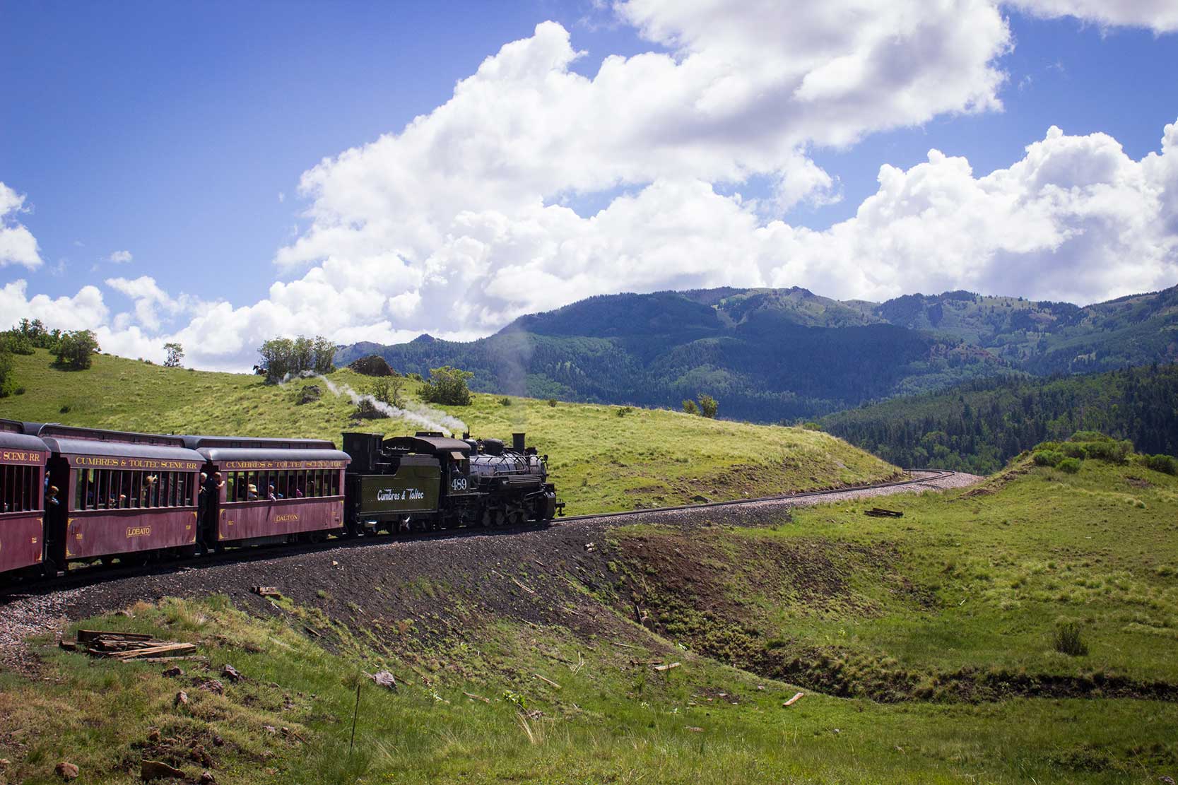 A train travels in the mountains