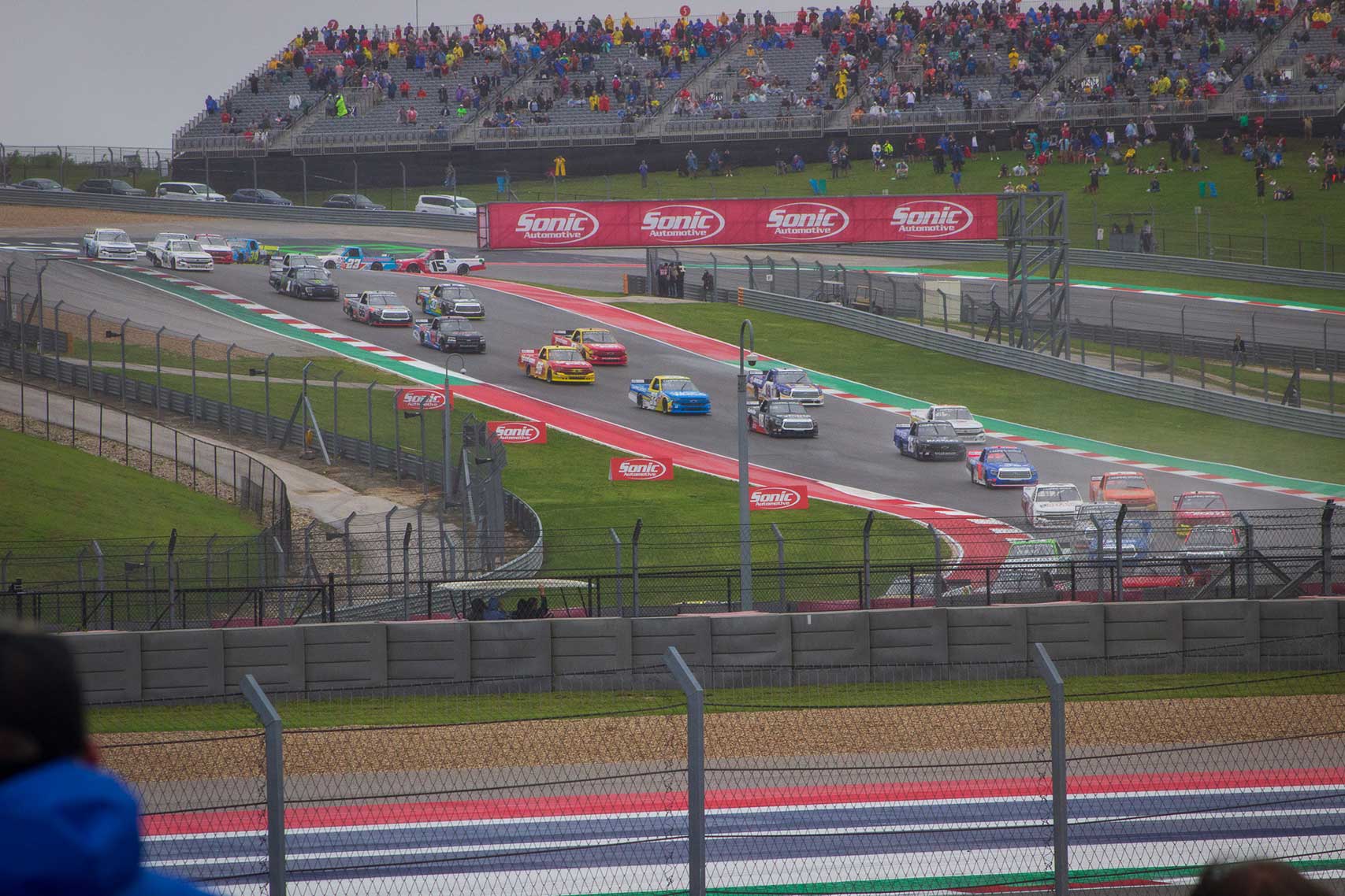 Racing trucks racing on a wet road course