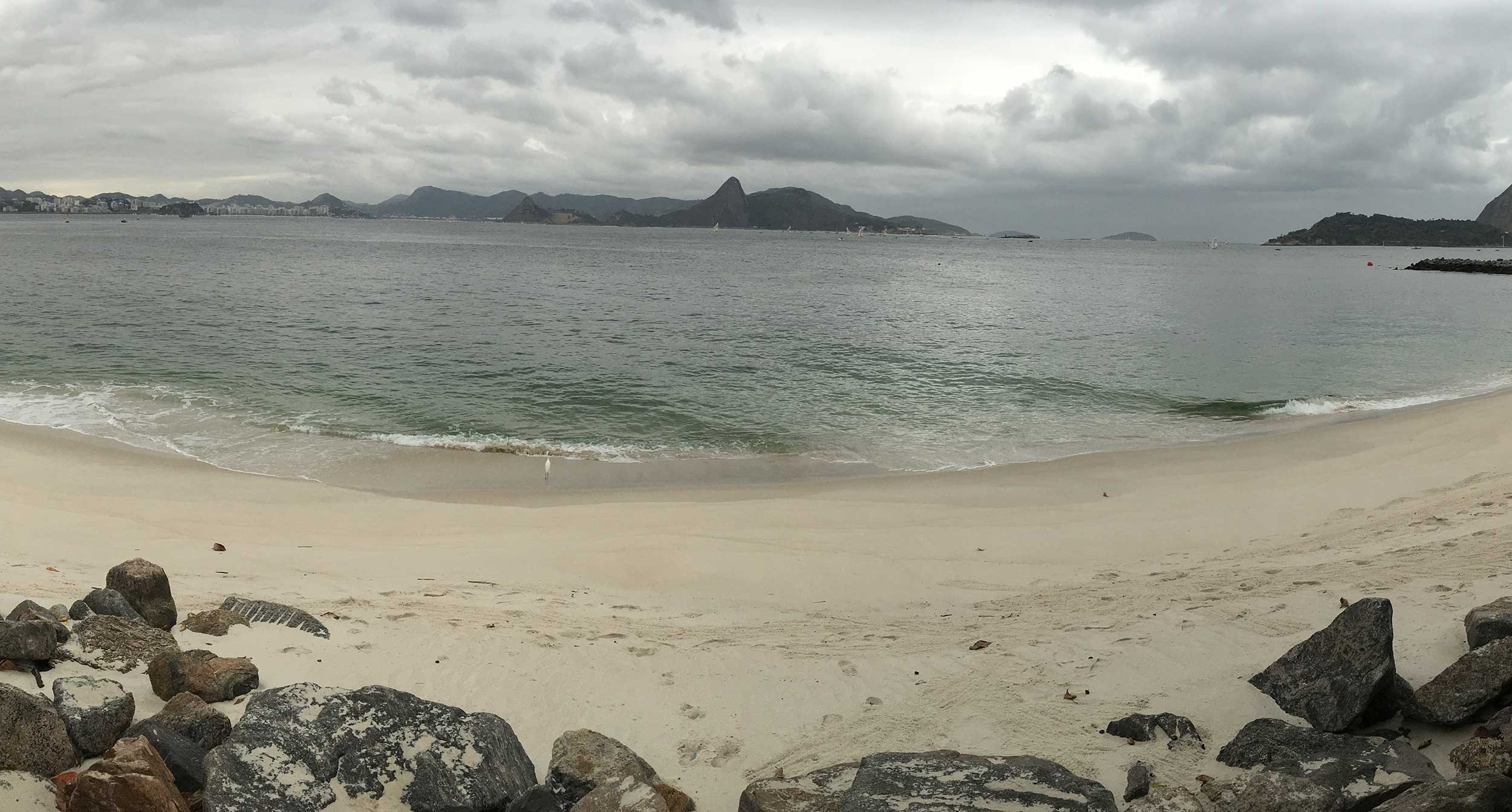 Flamengo beach looking out across the water with mountains in the background